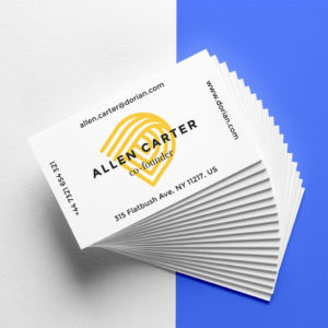 Stack of business cards with "Allen Carter, Co-founder" in black text over a yellow logo. Includes email, phone number, website, and address details. Background is split white and blue.